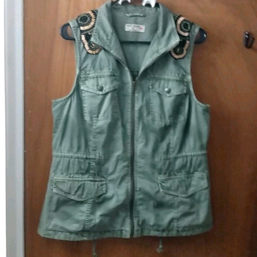 A cute outside vest w beaded detail